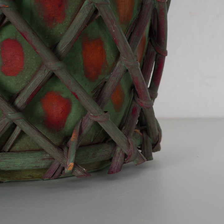 Authentic terracotta vase with wooden wickerwork