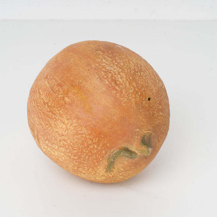 Decoratieve sculptuur van een citrusvrucht – steen of gips – 15 x 12 x 11 cm