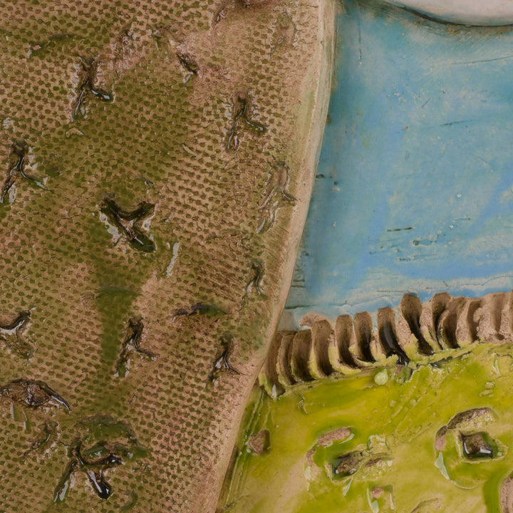 Ludiek geometrisch keramisch beeld – Gezichten in lichtblauw en groentinten