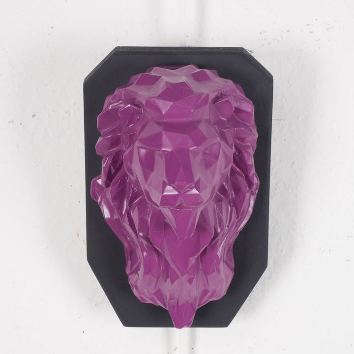 Artwork of a lion head in purple in resin