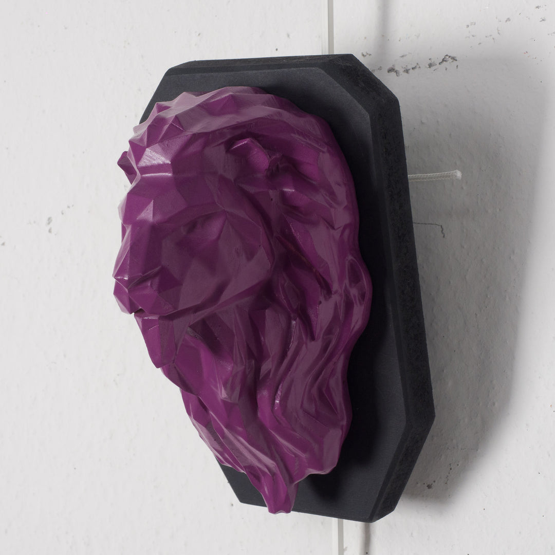 Artwork of a lion head in purple in resin