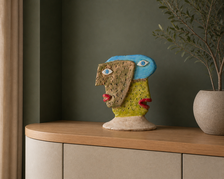 Playful geometric ceramic sculpture – Faces in light blue and green tones 