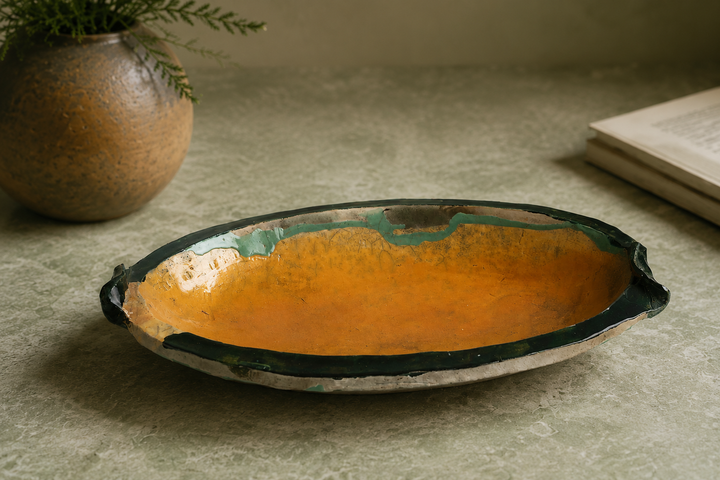 Flat ceramic bowl in ocher and green