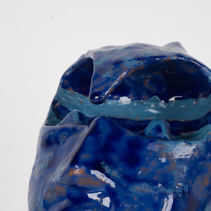 Ceramic face in blue glaze