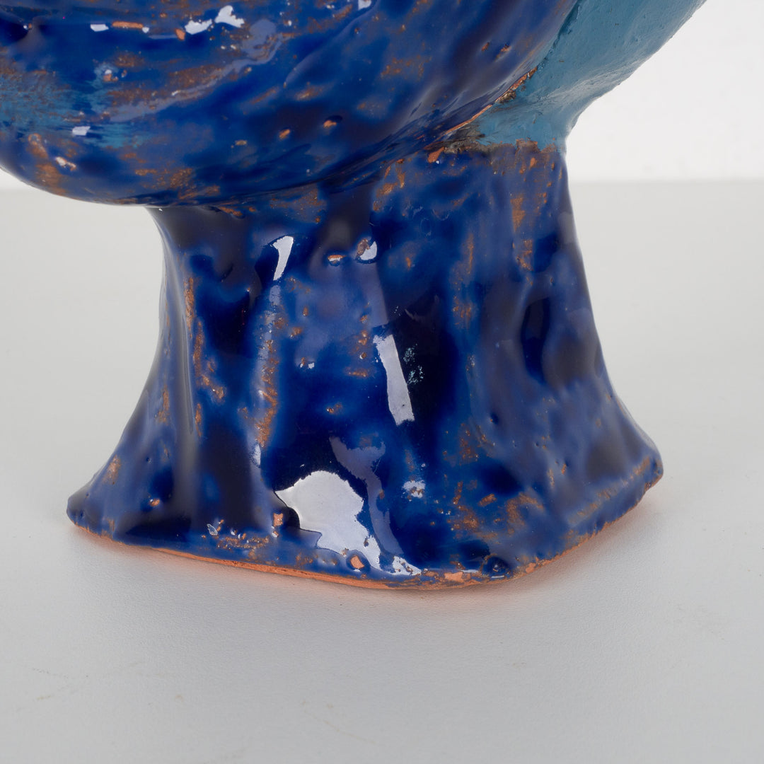 Ceramic face in blue glaze