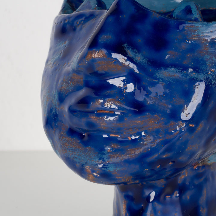 Ceramic face in blue glaze